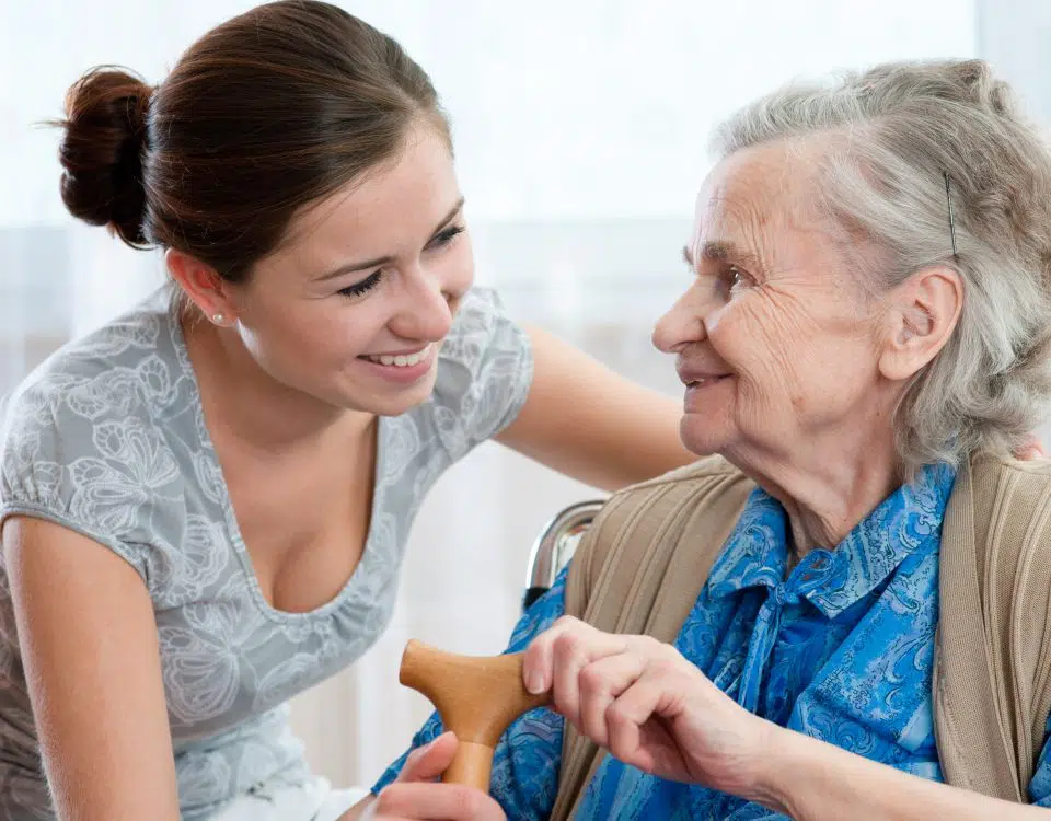 An elderly woman assisted by her personal home care attendant