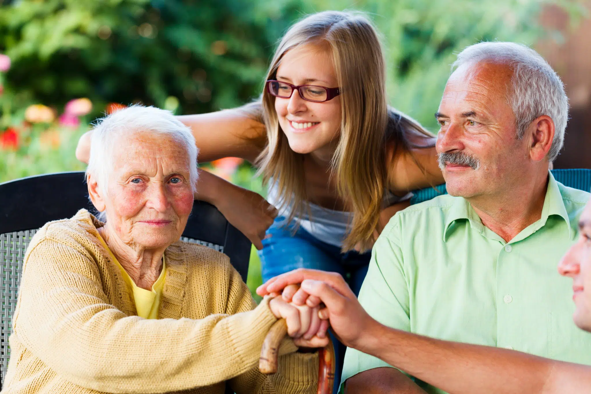 An elderly couple spending time with family