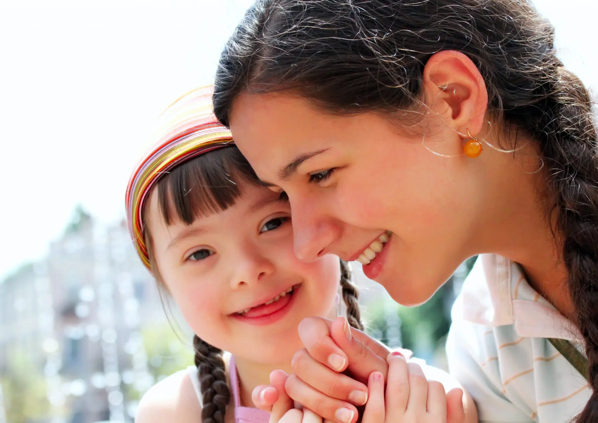 A young woman communicating on behalf of a young girl