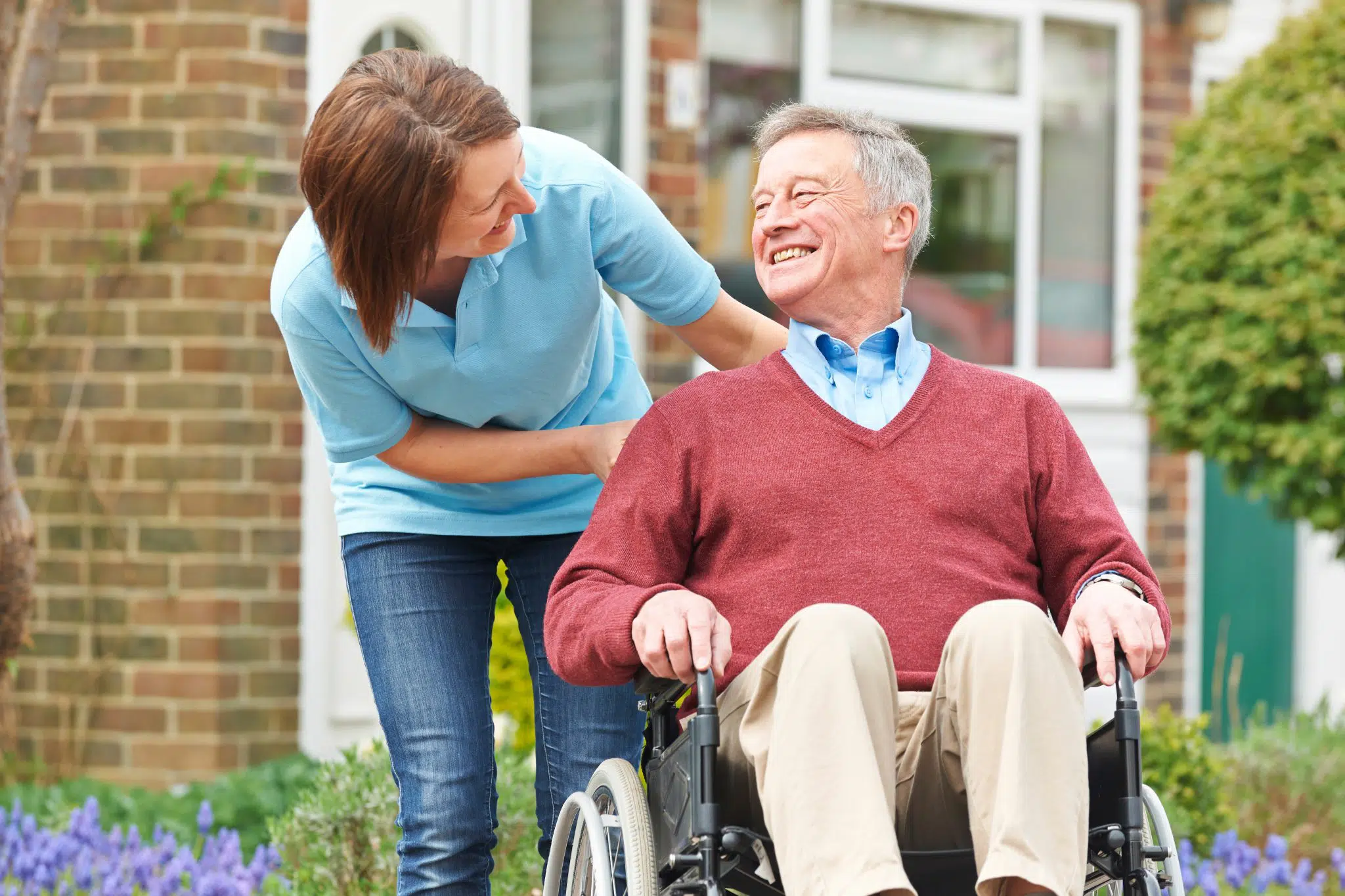 A father and daughter smiling at one another