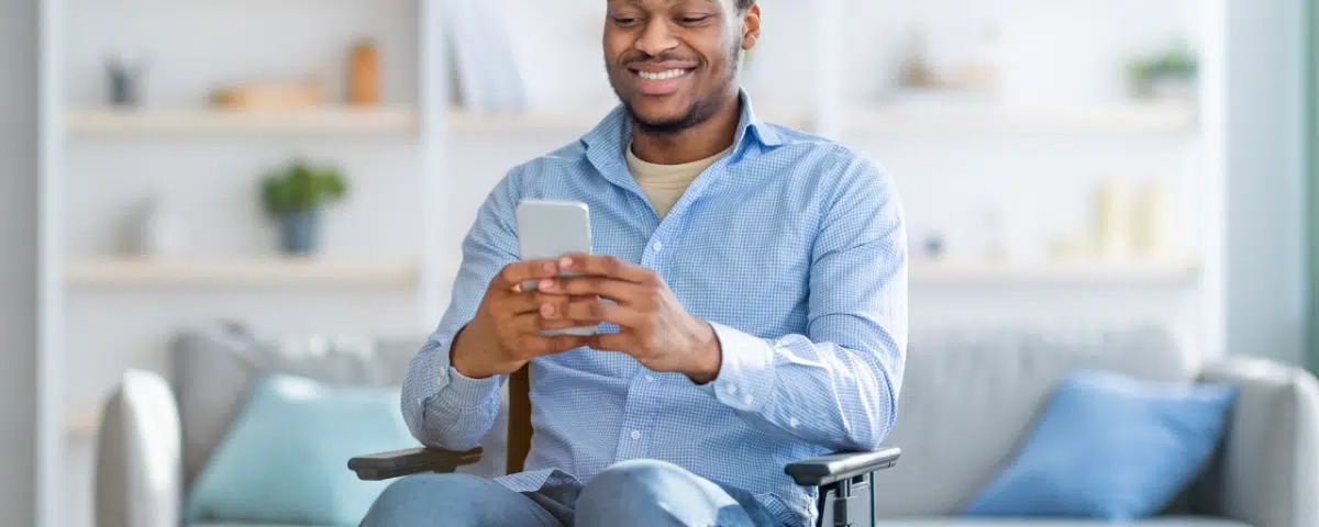 Man in Wheelchair on phone at home