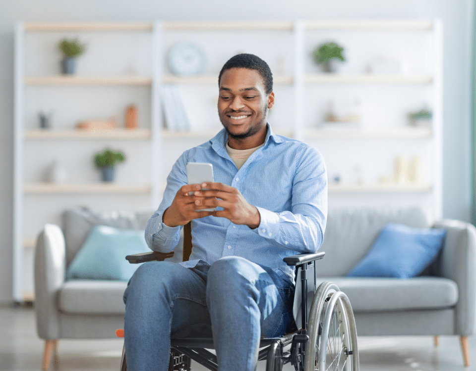 Man in Wheelchair on phone at home