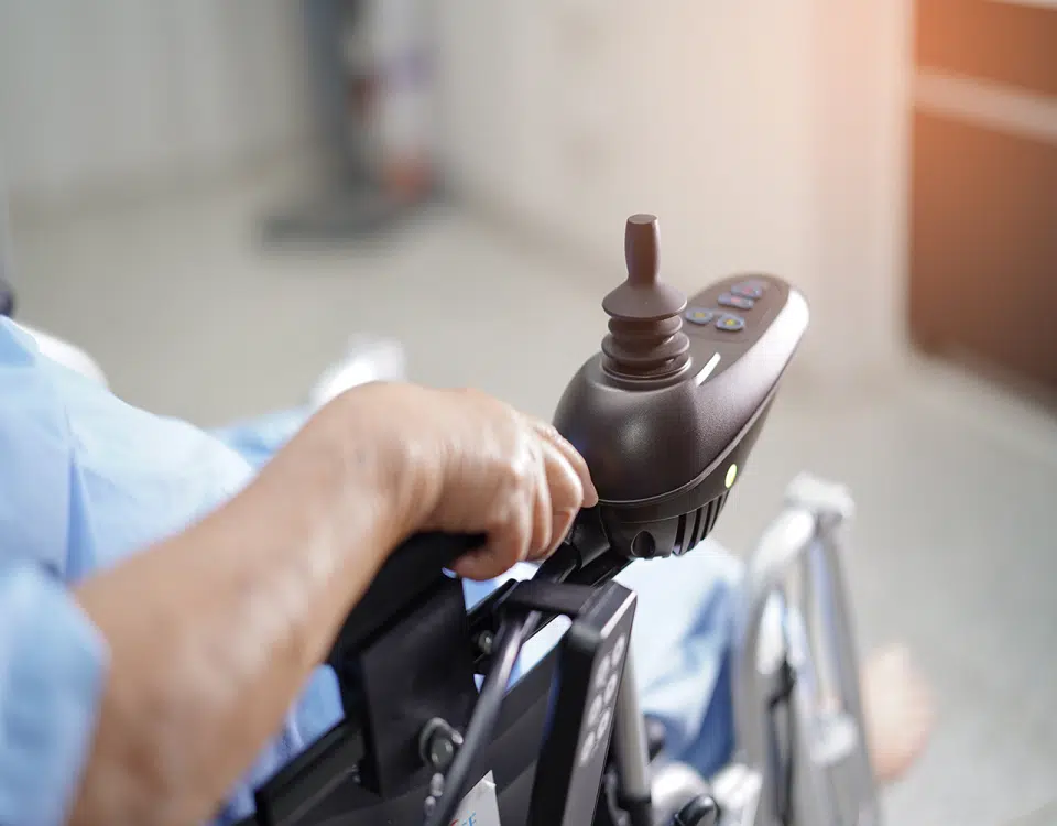 female sitting in motorized wheelchair